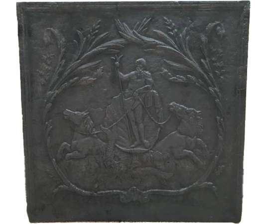 Ancient fireplace insert in late 18th century cast iron