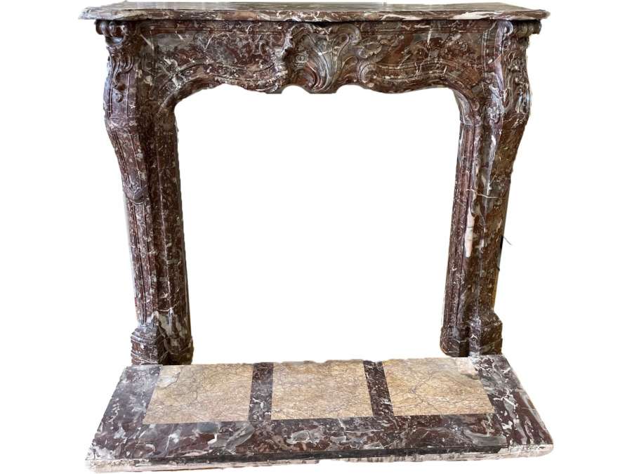 beautiful and small antique Louis XV style fireplace dating from the end of the 19th century made of rence red marble