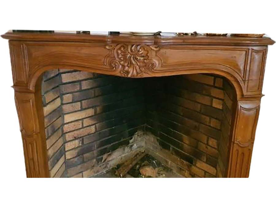 Pretty Louis XV style old oak fireplace made in the middle of the 20th century.