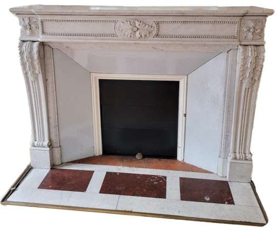 beautiful old Louis XVI style fireplace with rosettes and acanthus and pearl decorations