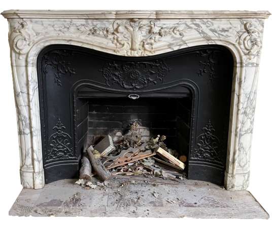 beautiful old Loui XV style fireplace with voluptes made in arabescato marble