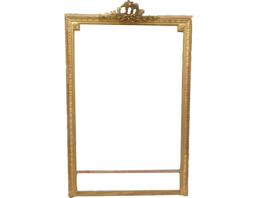 Beautiful Louis XVI style golden fireplace mirror decorated with an olive branch and rosettes