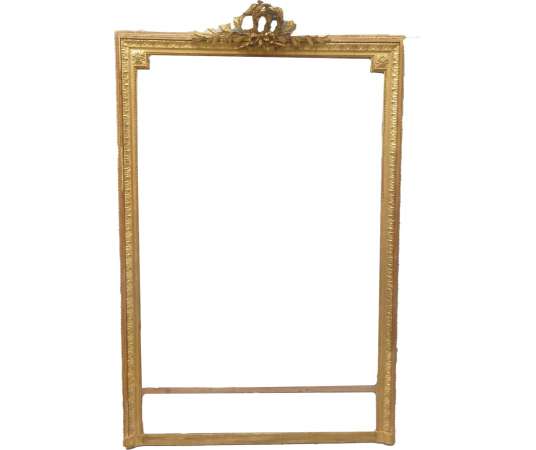 Beautiful Louis XVI style golden fireplace mirror decorated with an olive branch and rosettes