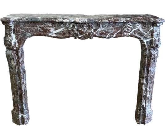 Elegant antique Louis XV fireplace in royal red marble