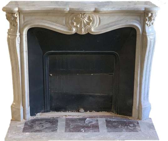 Pretty antique Louis XV style fireplace with three shells in white carrara marble dating from the...