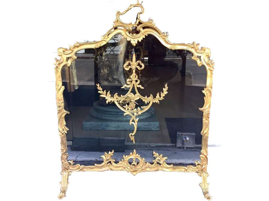Fireplace mantelpiece +in bronze Louis XV style. 19th century