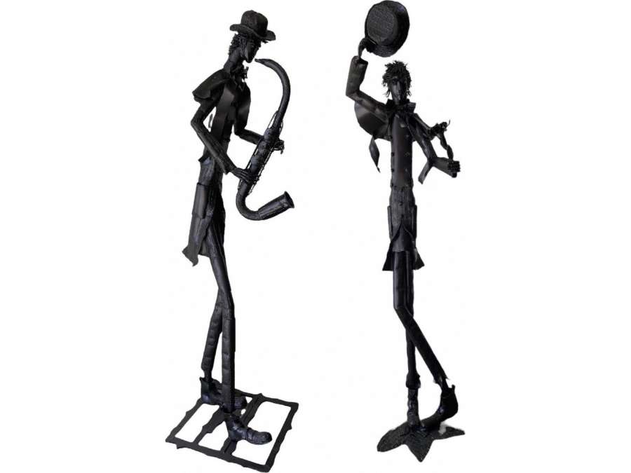 Iron Sculptures By The Artist Jean Alexandre Delattre The Man With Flowers And The Man With The Saxophone.