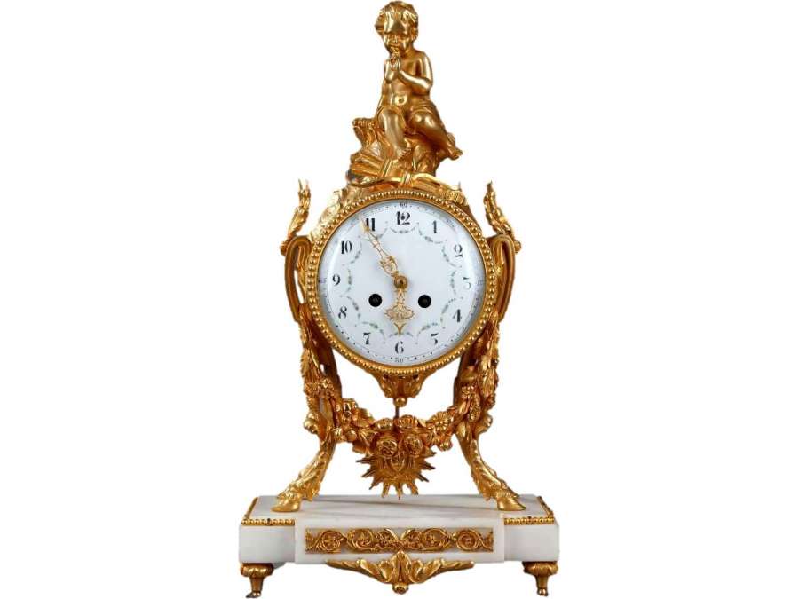 A Louis XVI Clock In White Marble And Gilded Bronze.