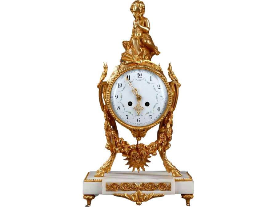 A Louis XVI Clock In White Marble And Gilded Bronze. - antique clocks