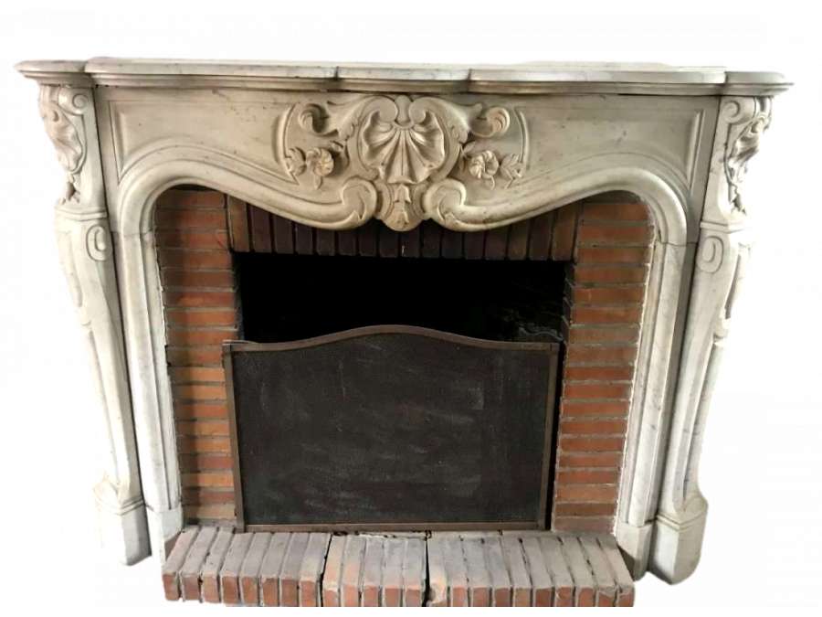 Louis XV fireplace with three shells +and marble from the 19th century