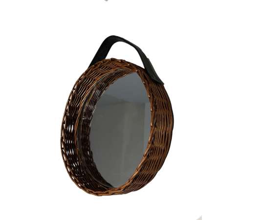 Vintage round mirror in leather and rattan from the 20th century