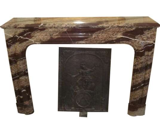 Antique Louis XIV style fireplace dating from the end of the 19th century in wrapped campan marble