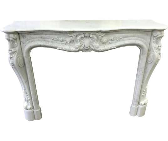 Ancient Louis XV style fireplace in white carrare marble from the 19th century