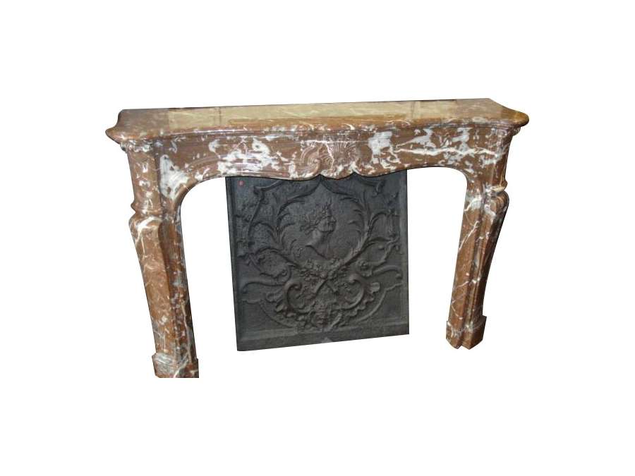 Antique Louis XV period fireplace in belgian red marble.