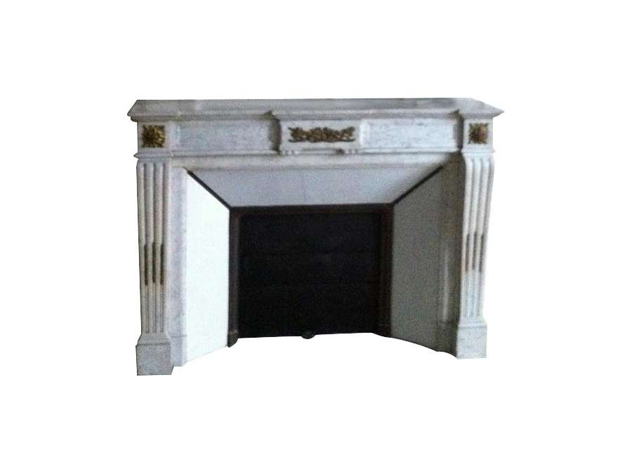 Antique louis XVI style fireplace decorated with gilded bronzes in white carrara marble late 19th...