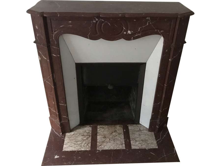 Antique pompadour style fireplace