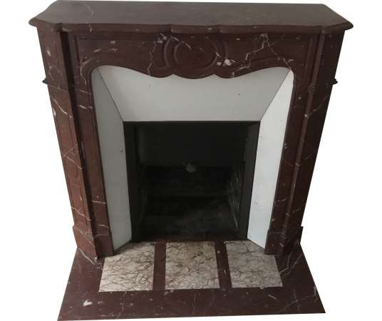 Antique pompadour style fireplace