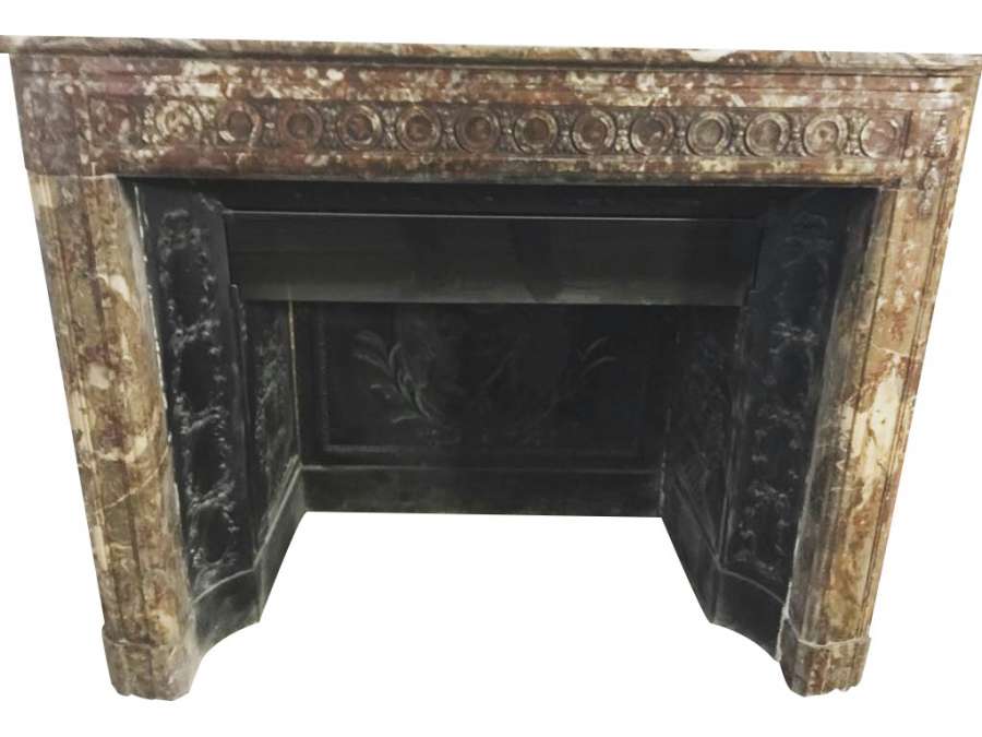 Elegant antique louis XVI fireplace with flower decorations in red rance marble