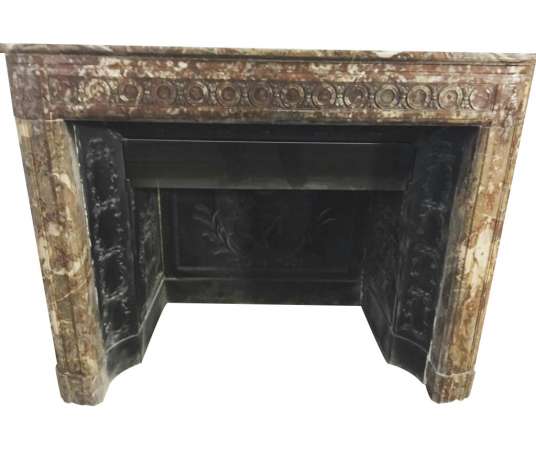 Elegant antique louis XVI fireplace with flower decorations in red rance marble