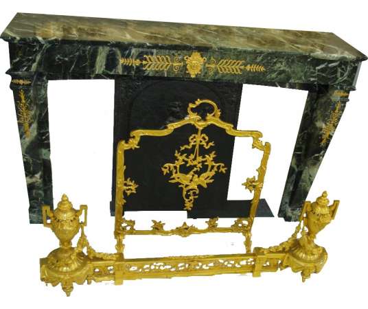 Old fireplace, 19th century in sea green marble with decorations of gilded bronze