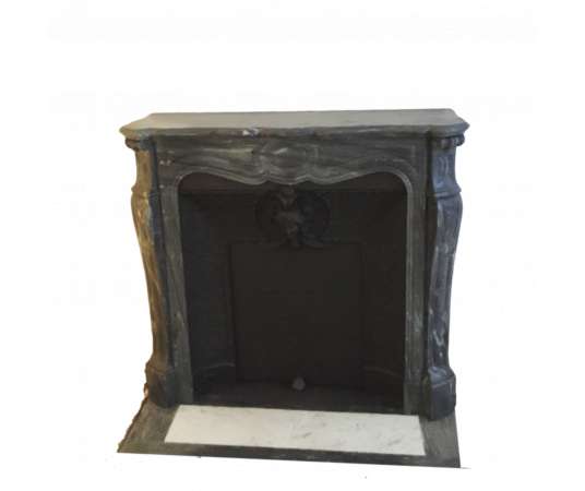 Antique late 19th century blue turquin marble fireplace known as pompadour on louis xv feet