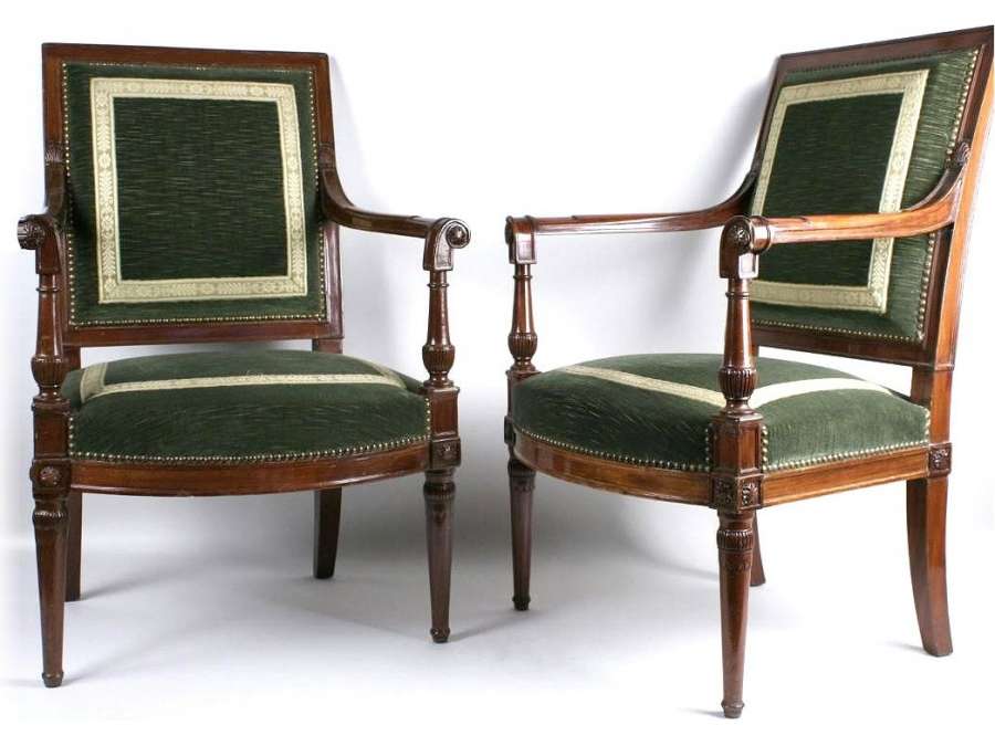 A Directory (1795-1799) period pair of mahogany armchairs from the Saint Cloud castle.