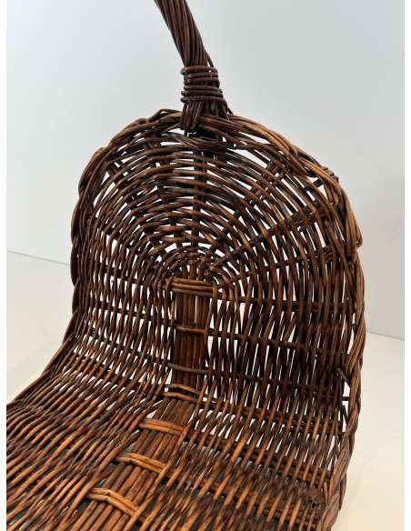 Contemporary wicker firewood holder from the 70s-Bozaart