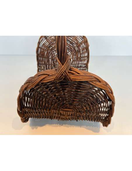 Contemporary wicker firewood holder from the 70s-Bozaart