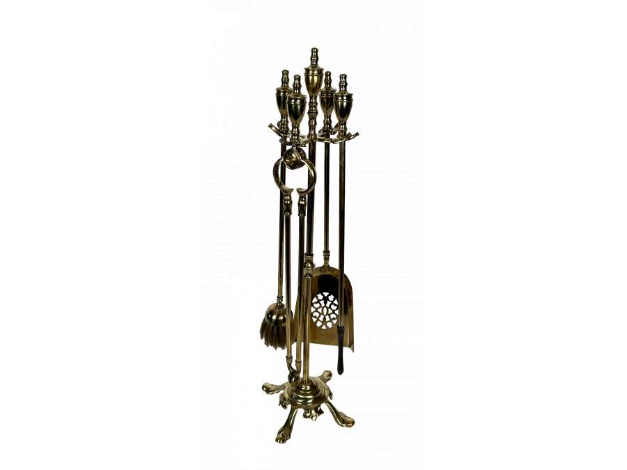 Neoclassical brass fireplace accessories +from the 1940s