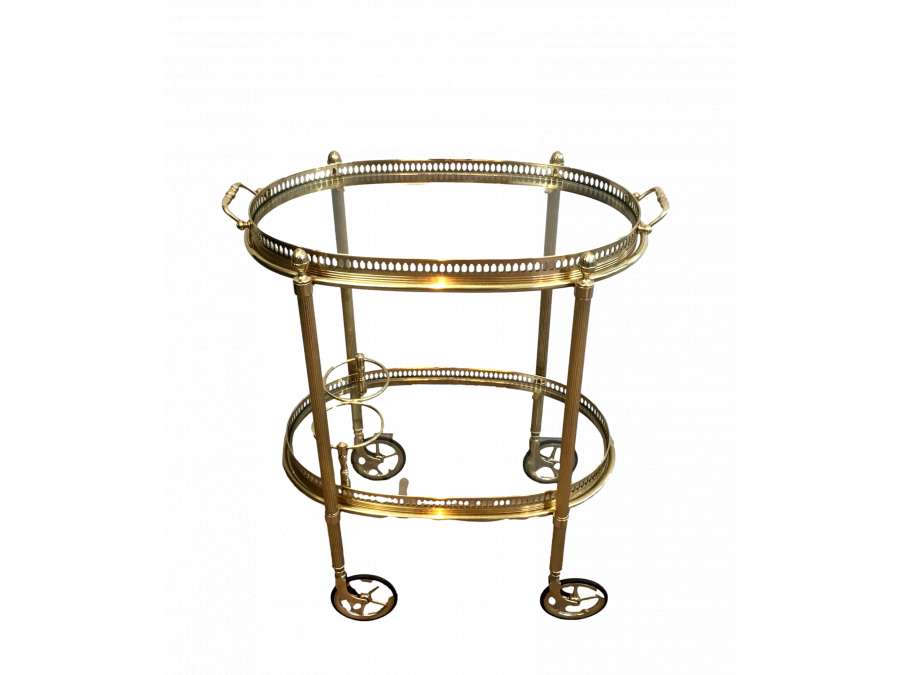 Maison Bagués, Oval brass rolling table from the 40s