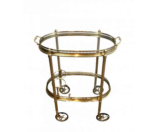 Maison Bagués, Oval brass rolling table from the 40s