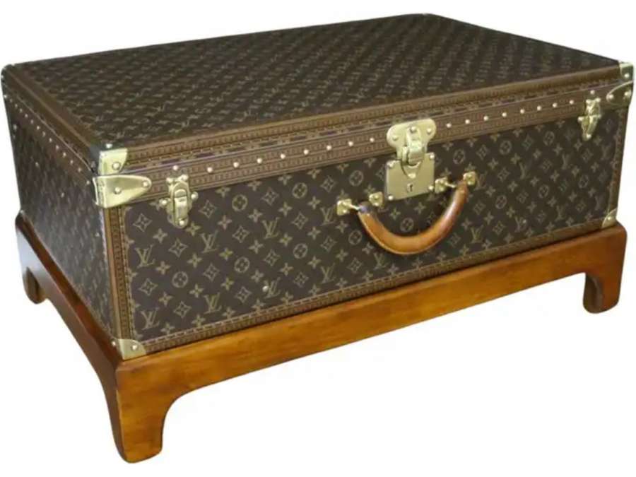 21st century +Louis Vuitton suitcase