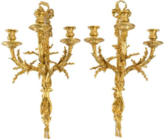 A Pair of wall-lights in Louis XVI style dated 1881.