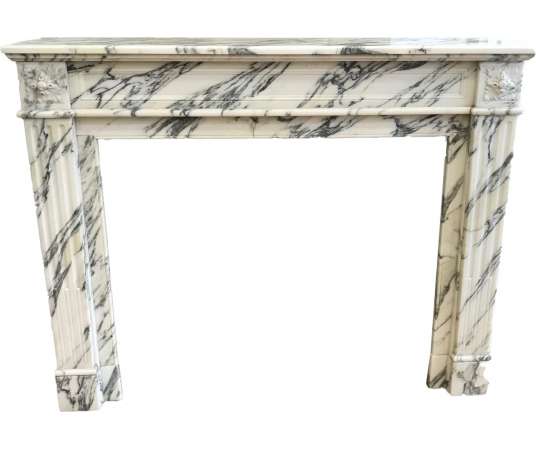 Beautiful antique Louis XVI style fireplace in Arabescato marble dating from the end of the 19th...