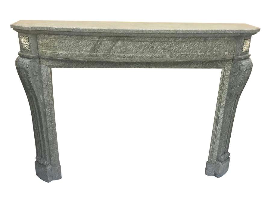 Antique Louis XVI style fireplace dating from the end of the 19th century in Vert D'estour marble with bronze decorations
